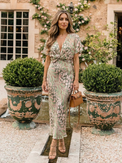 Coral | Vestido midi con estampado abstracto, escote en V y cintura con nudo
